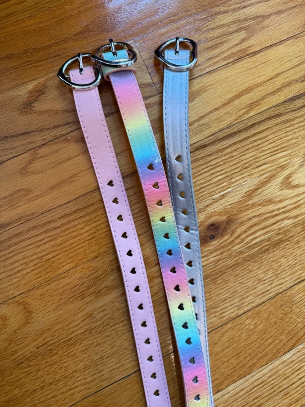 Set of 3 Heart-Punched Belts in Pastel Pink, Rainbow, and Metallic Silver